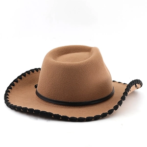 Close-up of brown wool fedora hat featuring black braided trim and leather hatband