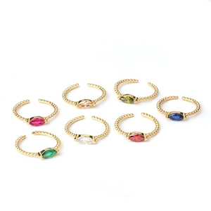 Adjustable gold rings set with colorful marquise-cut gemstones in a row