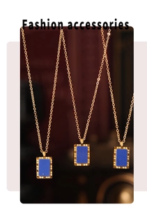 Three gold necklaces featuring rectangular blue lapis stone pendants with wavy borders