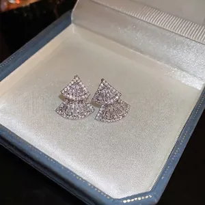Silver-finish geometric fan stud earrings with pavé cubic zirconia on silk lining
