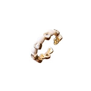14K gold plated open ring featuring white enamel hearts and sparkling cubic zirconia