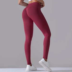 Rear view of seamless burgundy yoga pants with peach lift and high waist compression