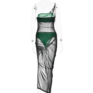 Rear view of three-piece set with green tube top and black sheer mesh maxi dress