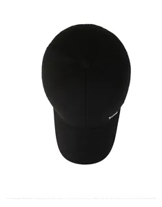 Top down view of black winter baseball cap featuring thickened wool fabric and metal logo