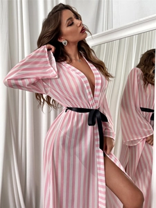 Detail of pink striped long satin robe featuring a black satin bow waist tie and V-neck