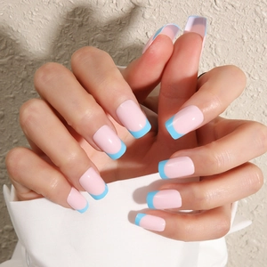 Detail of square round long press-on nails with light pink base and light blue french tips