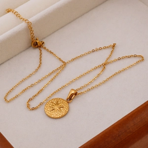 18K gold plated stainless steel coin necklace with starburst pendant on velvet lining