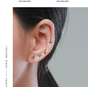 Close-up of S925 silver stud earrings with colorful zircon in strawberry and mushroom shapes