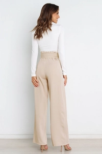 Rear view of high-waisted wide-leg pants in beige showing the elegant tailored fit
