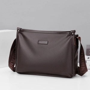 Dark brown large capacity crossbody bag with lychee texture and embossed strap