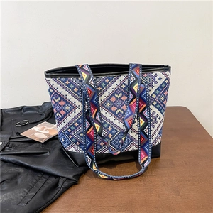 Ethnic large capacity tote bag with colorful geometric patterns and black leather trim