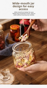 Macro view of glass storage jar with heart lid featuring large opening for dry pasta