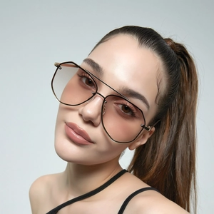 Modern oversized gold metal aviator sunglasses with brown gradient lenses for men and women