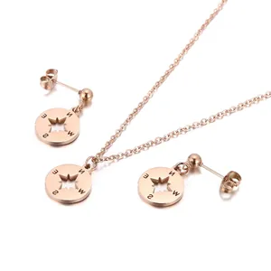 Parure collier et boucles d'oreilles boussole en acier inoxydable fini or rose
