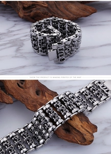 Detail view of multi-row skull link chain bracelet in punk stainless steel style
