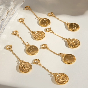 Golden zodiac sign pendant charms made of stainless steel with sparkling crystals