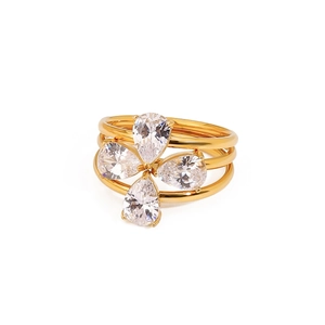 Gold layered stainless steel ring with pear-shaped clear crystals in floral arrangement