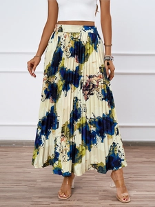 Close-up of a high-waisted pleated midi skirt featuring abstract oil painting prints