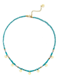 Detail of colorful beaded necklace with gold steel discs and lobster clasp closure