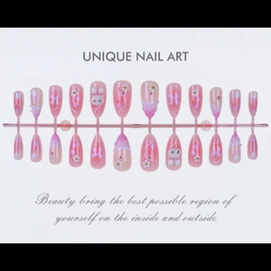 Flat lay of almond press-on nails with 3D bunny, bear and bow charms in pink and purple