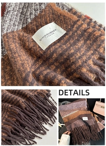 Detail of checkered knit scarf featuring fringe tassels and brand logo label