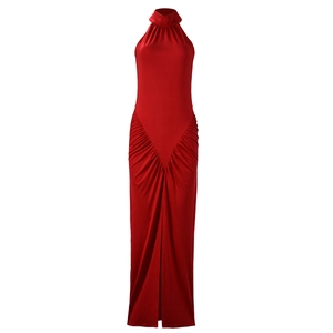 Detail of red halter neck maxi dress featuring elegant ruched fabric and front slit design