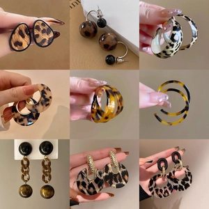 Detailed grid of nine leopard print and tortoiseshell resin earrings in various trendy styles