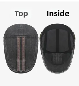 Detailed top view and interior lining of a vintage washed grey cotton flat cap with straps