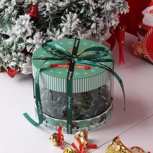 Round Christmas gift box with clear window, green lid and festive ribbon decoration