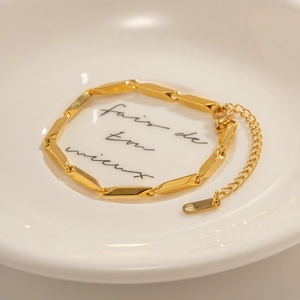 Minimalist gold geometric chain link necklace with lobster clasp in an elegant tray