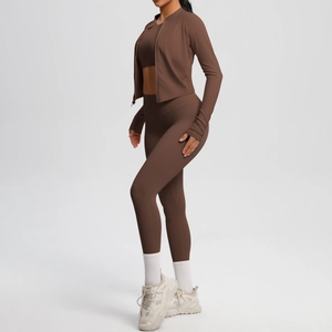 Three-piece brown yoga set featuring zipper jacket, sports bra, and high-waist leggings