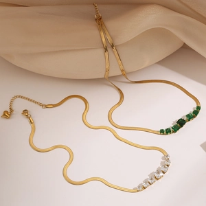 Gold-plated titanium steel snake bone necklaces with green and white zircon heart pendants