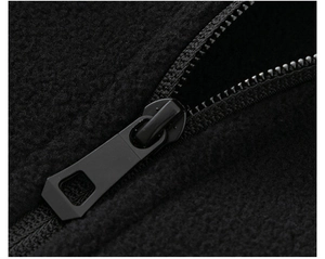 Macro shot of high-quality matte black zipper on textured polar fleece outdoor jacket