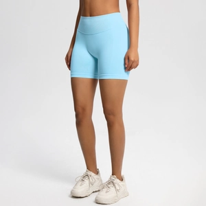 Detail of high-waisted seamless fitness shorts in sky blue with supportive ribbed waistband