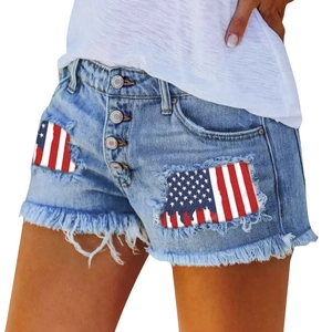 Distressed high-waist light blue denim shorts with American flag patch and frayed hem