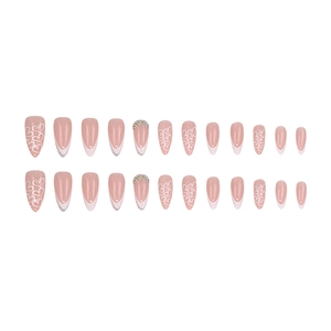 Almond press-on nails with white French tips, heart patterns, and sparkling rhinestones