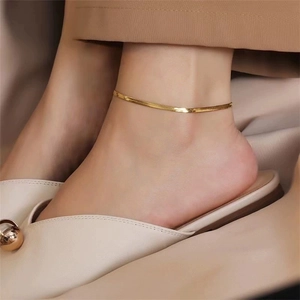 Elegant gold plated stainless steel snake chain anklet for women on model's ankle