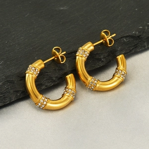 18k gold plated stainless steel hoop earrings with sparkling rhinestones on grey stone