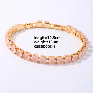 Detail of 19.5cm gold link bracelet with micro-pave pink cubic zirconia and fold-over clasp