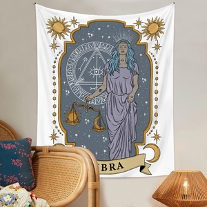 Detailed fabric texture of Libra zodiac tapestry with golden sun and moon elements