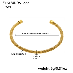 Detail showing 6.3cm inner diameter and 0.4cm thickness of golden stainless steel bangle
