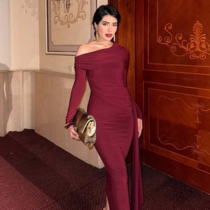 Detail of burgundy one-shoulder long dress with elegant ruching and slim fit design