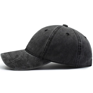 Black washed cotton baseball cap for men and women shown from a 45-degree angle view