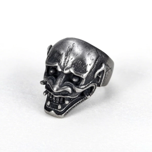 Gothic Hannya mask ring in oxidized stainless steel shown from a 45-degree angle view