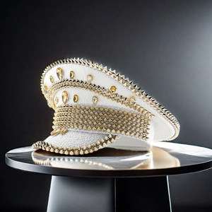Detail of white party captain hat featuring silver sequins, gold spikes, and rhinestones