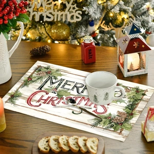 Merry Christmas placemat with pine branches and berries on a wooden dining table