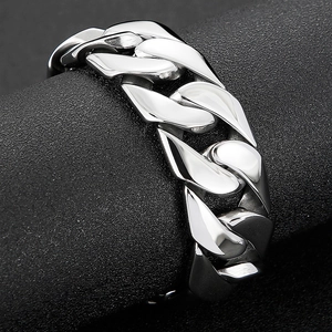 Macro shot of silver Cuban link ring with a high-polished finish on a display stand