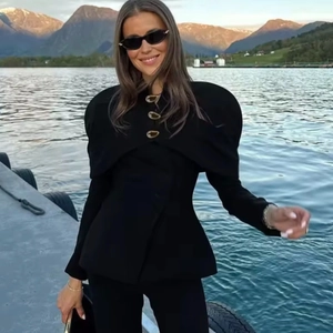 Women's chic black stand collar jacket with unique gold buttons and curved lapel detail