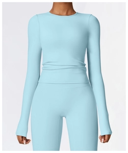 Detail of light blue brushed long sleeve yoga top and high waist leggings set