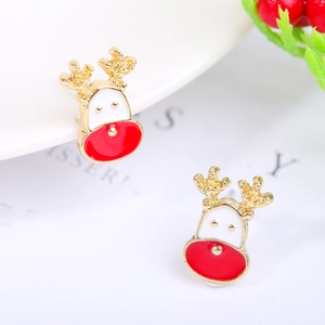 Macro shot of reindeer stud earrings with gold plating and red enamel finish